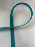Teal strap on a white background